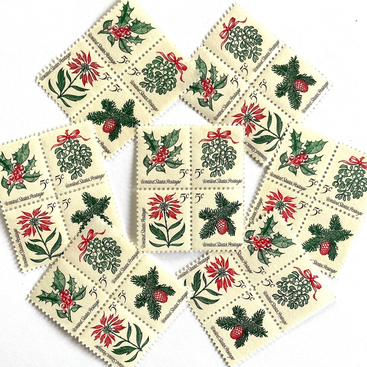 Image of four 5-cent “Christmas Issue Se-Tenant” USPS postage stamps featuring green and red holiday plants from the 1964 Contemporary Christmas Series. Mistletoe, Holly, Poinsettia, Evergreen. Scott #1254, Scott #1255, Scott #1256, Scott #1257.