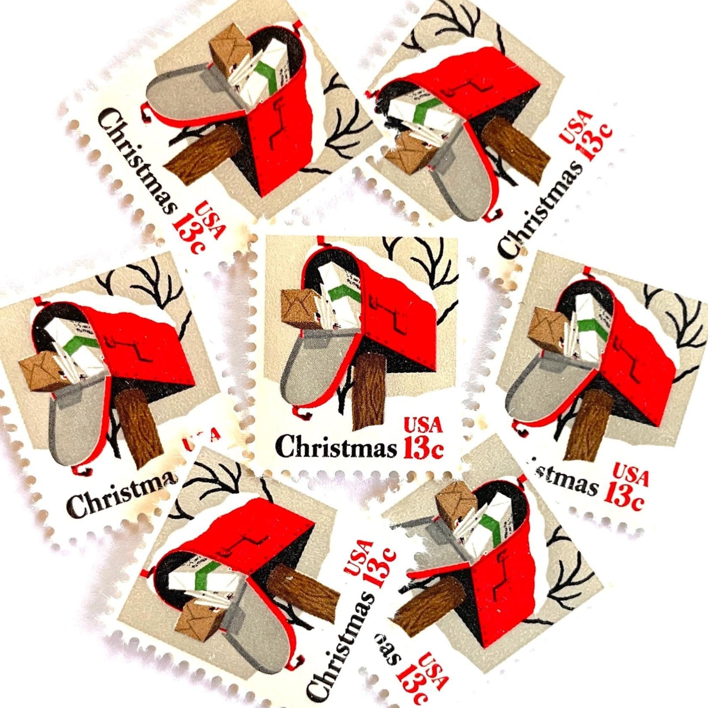 Image of 1977 Contemporary Christmas “Rural Mailbox” 32-cent stamps. Scott #1730. Stamp Themes: Mailbox, Christmas Mail, Christmas Parcels, Christmas Cards, Snow, Rural America. Red and white postage stamp.