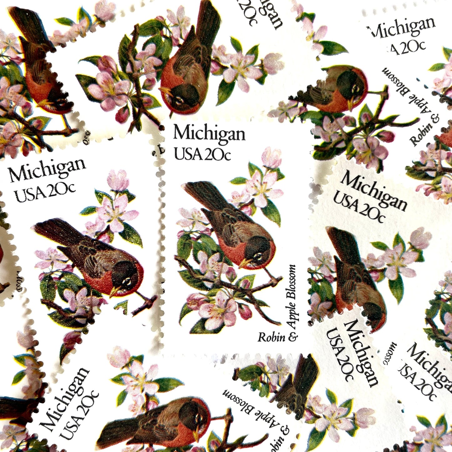 Image of Michigan State Bird and Flower postage stamps from 1982, featuring a Robin and Apple Blossom on vintage unused 20-cent USPS postage, Scott 1974.