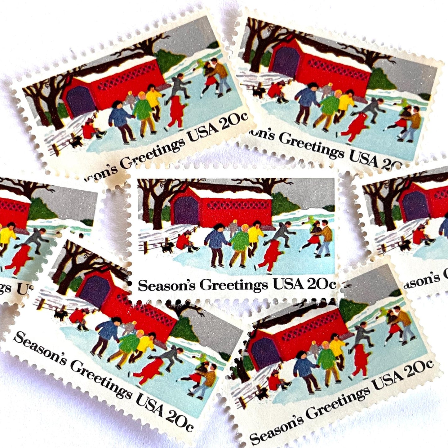 Image of 1982 Contemporary Christmas “Ice Skating” 20-cent stamps. Scott #2029. Stamp Themes: Ice Skating, Christmas, Winter Holidays, Snow, Winter Scene, Covered Bridge, Season's Greetings. Multicolored postage stamp.