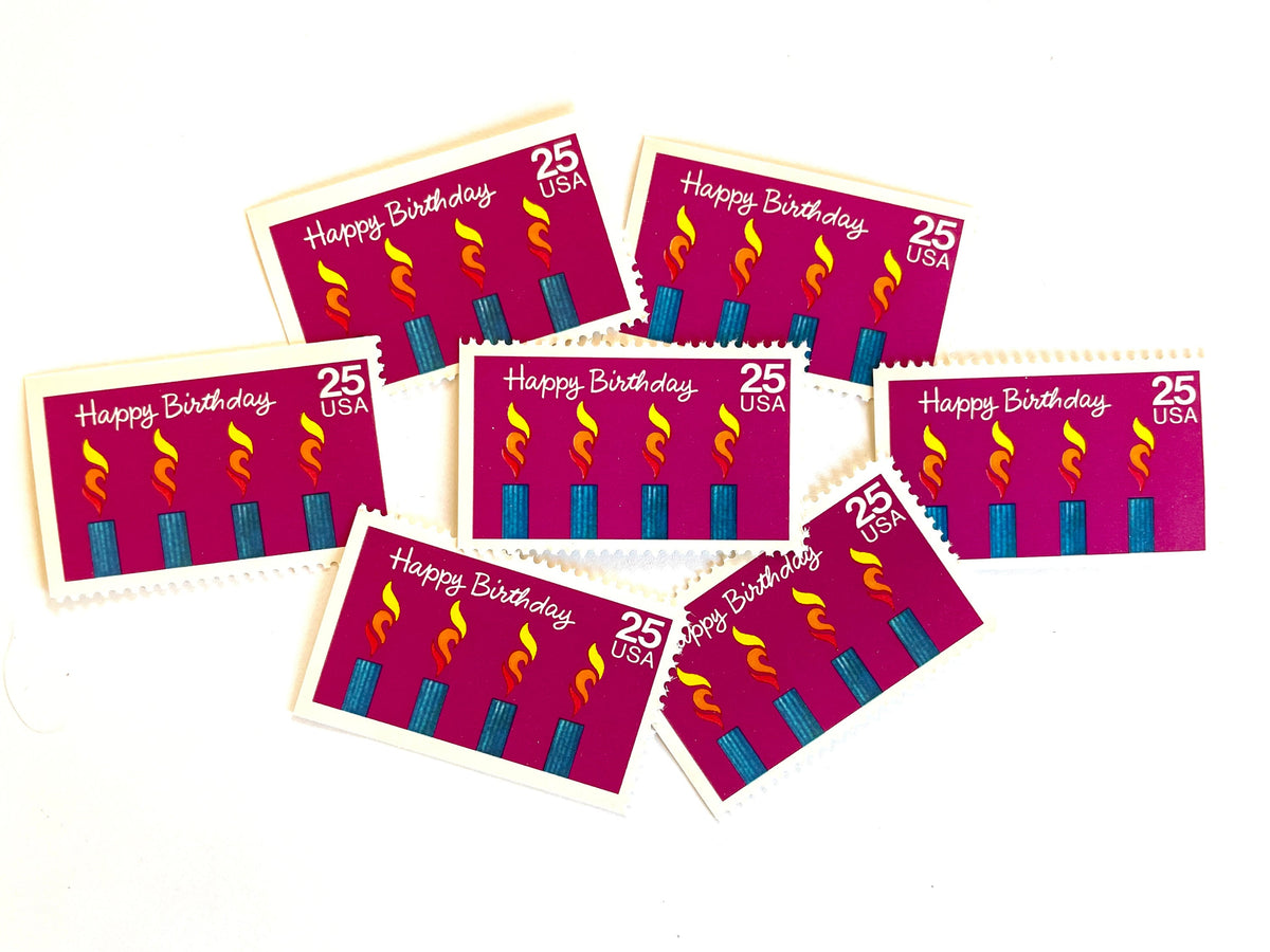Happy Birthday postage stamps from 1988 featuring four colorful burning candles against a purple background on vintage unused 25-cent USPS postage, Scott 2395.