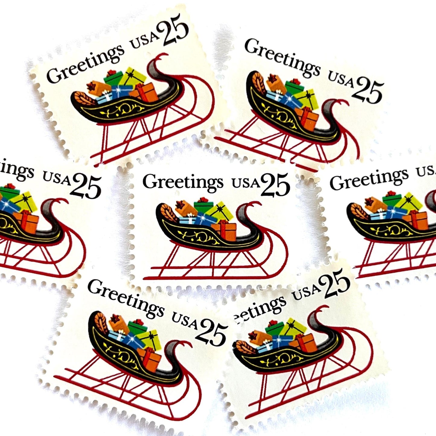 Image of 1989 Contemporary Christmas “Sleigh with Presents” 25-cent stamps. Scott #2428. Stamp Themes: Christmas, Holidays, Sleigh, Santa, Presents, Gifts, Greetings. Multicolored postage stamp.