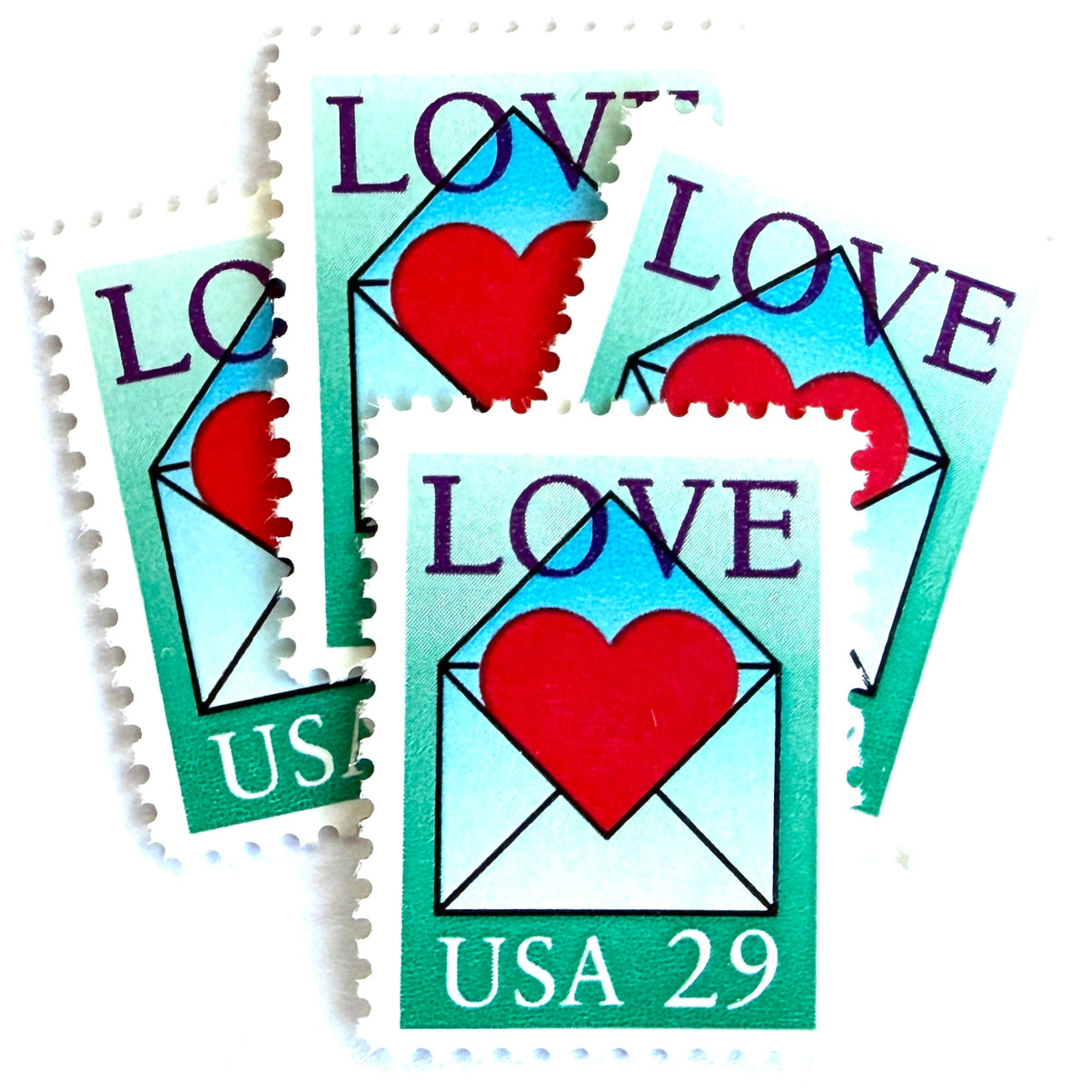 Love Envelope and Heart postage stamps from 1992 featuring a red heart emerging from an open blue envelope on vintage unused 29-cent USPS postage, Scott 2618.
