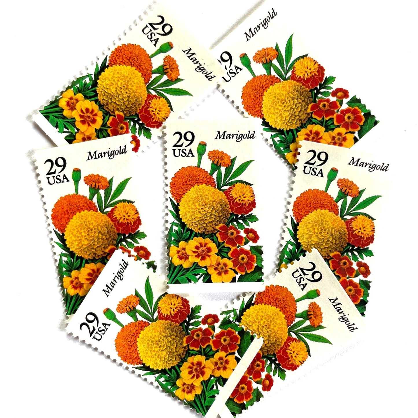 Image of Marigold postage stamps from the 1994 Summer Garden Flowers series, featuring orange, yellow, and red marigold blossoms with green foliage on vintage unused 29-cent USPS postage, Scott 2832