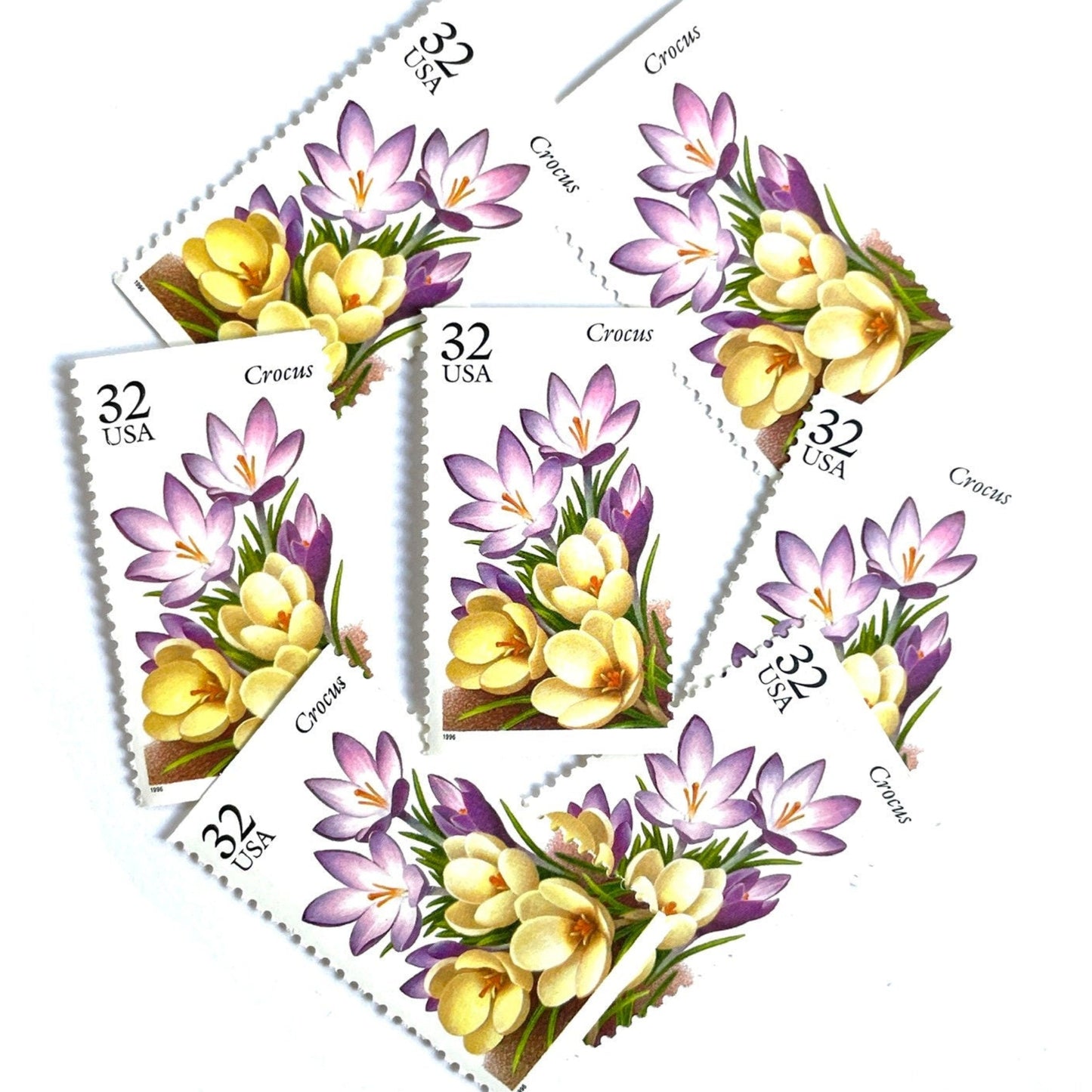 Image of vintage unused USPS Crocus postage stamps from the 1996 Winter Garden Flowers series, featuring a purple crocus flower with green foliage, 32-cent face value, Scott 3025.
