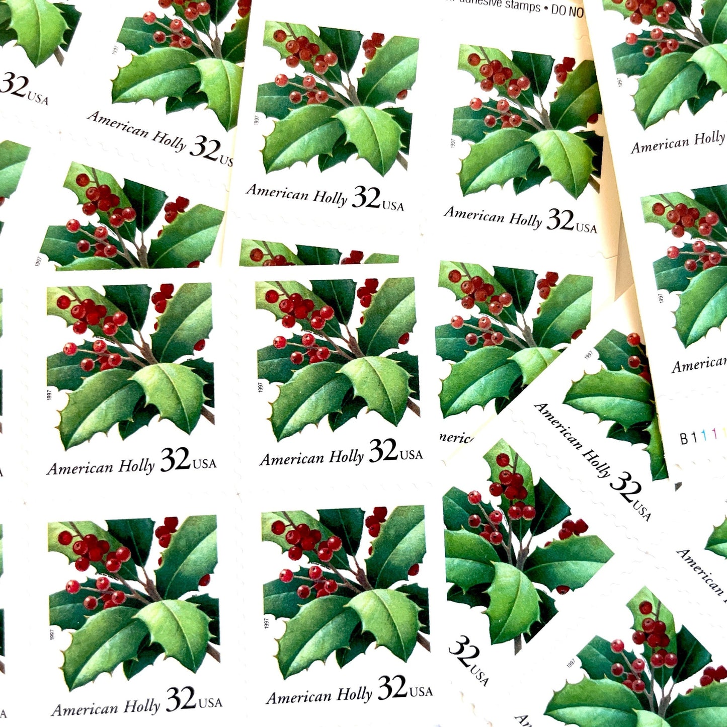 Image of 1997 Contemporary Christmas “American Holly” 32-cent stamps. Scott #3177. Stamp Themes: Holly, Red Berries, Christmas, Holidays, Winter, Evergreen. Green and red postage stamp.
