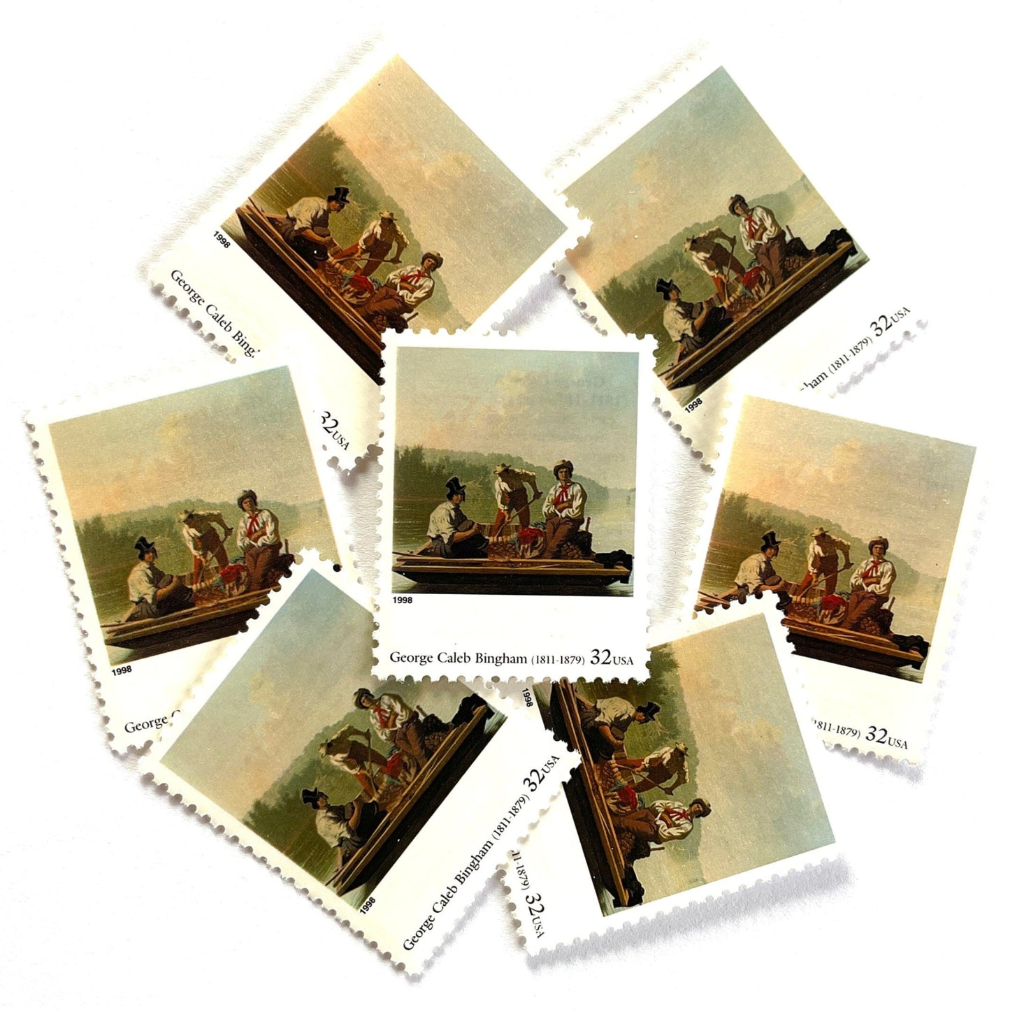 George Caleb Bingham’s “Boatmen on the Missouri" Postage Stamp from the 1998 Four Centuries of American Art Series. This stamp depicts the iconic landscape painting of boatmen navigating the Missouri River. An iconic nature theme, this postage stamp depicts the three med rafting down the Missouri River. These are vintage unused USPS postage stamps with a face value of 32 cents each. Scott number 3236F.