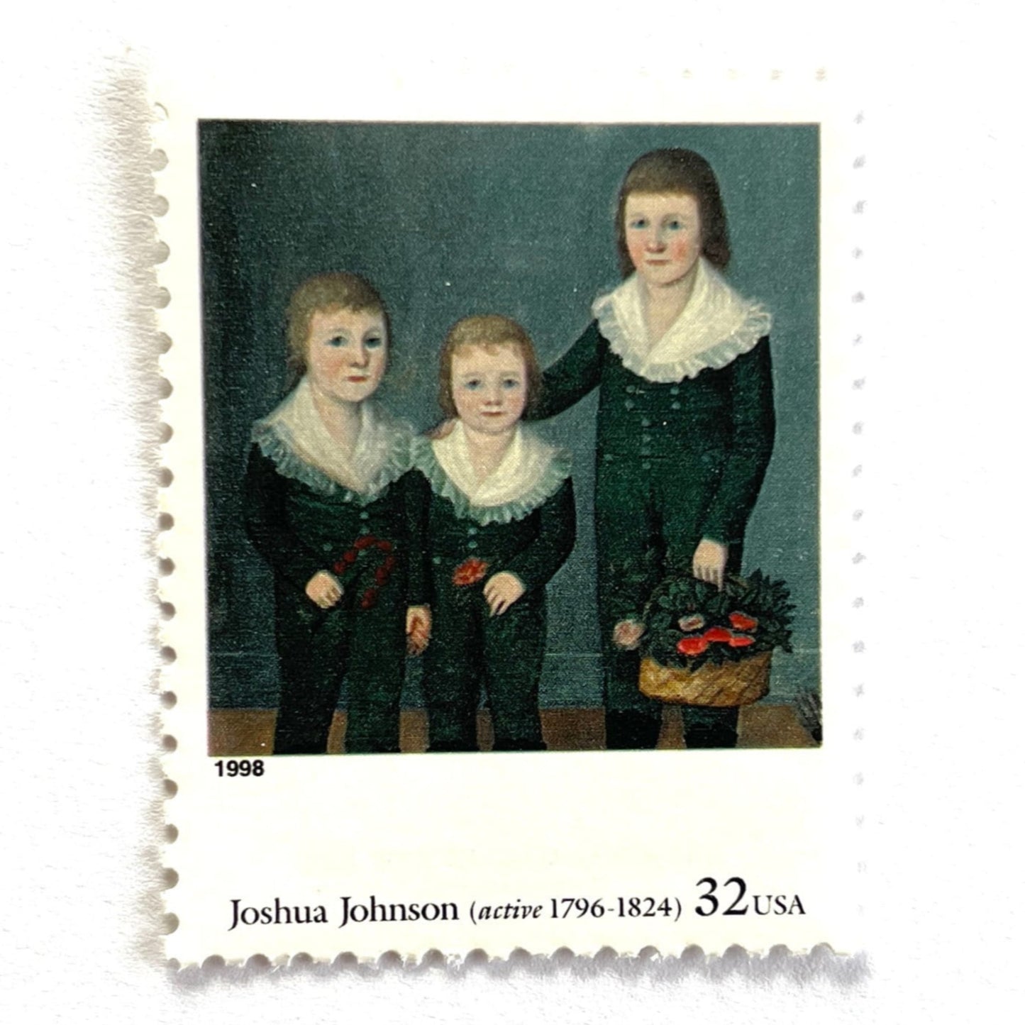 Close up image of Joshua Johnson’s “The Westwood Children" Postage Stamp from the 1998 Four Centuries of American Art Series. This stamp depicts a trio of children, the Westwood siblings, painted in the folk style. An iconic childhood theme, this predominately blue postage stamp painted by one of the first recognized African American painters, is often used to mail wedding invitations. These are vintage unused USPS postage stamps with a face value of 32 cents each. Scott number 3236H.