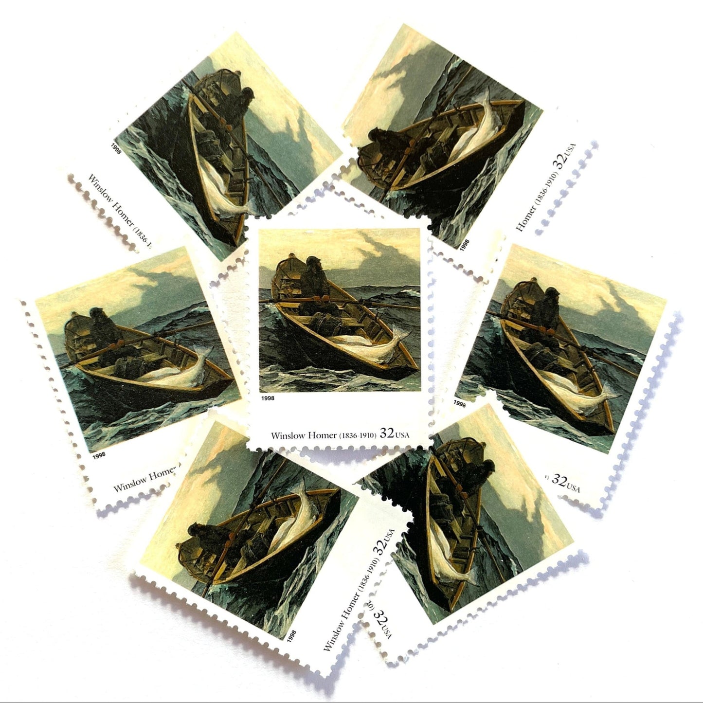Winslow Homer’s "The Fog Warning" Postage Stamp from the 1998 Four Centuries of American Art Series. This stamp depicts a painting of a lone rowboat in choppy water, with fish on board, as the oarsman rows towards shore before the impending storm. An iconic nautical theme, this postage stamp is often used to mail wedding invitations. These are vintage unused USPS postage stamps with a face value of 32 cents each. Scott number 3236J.