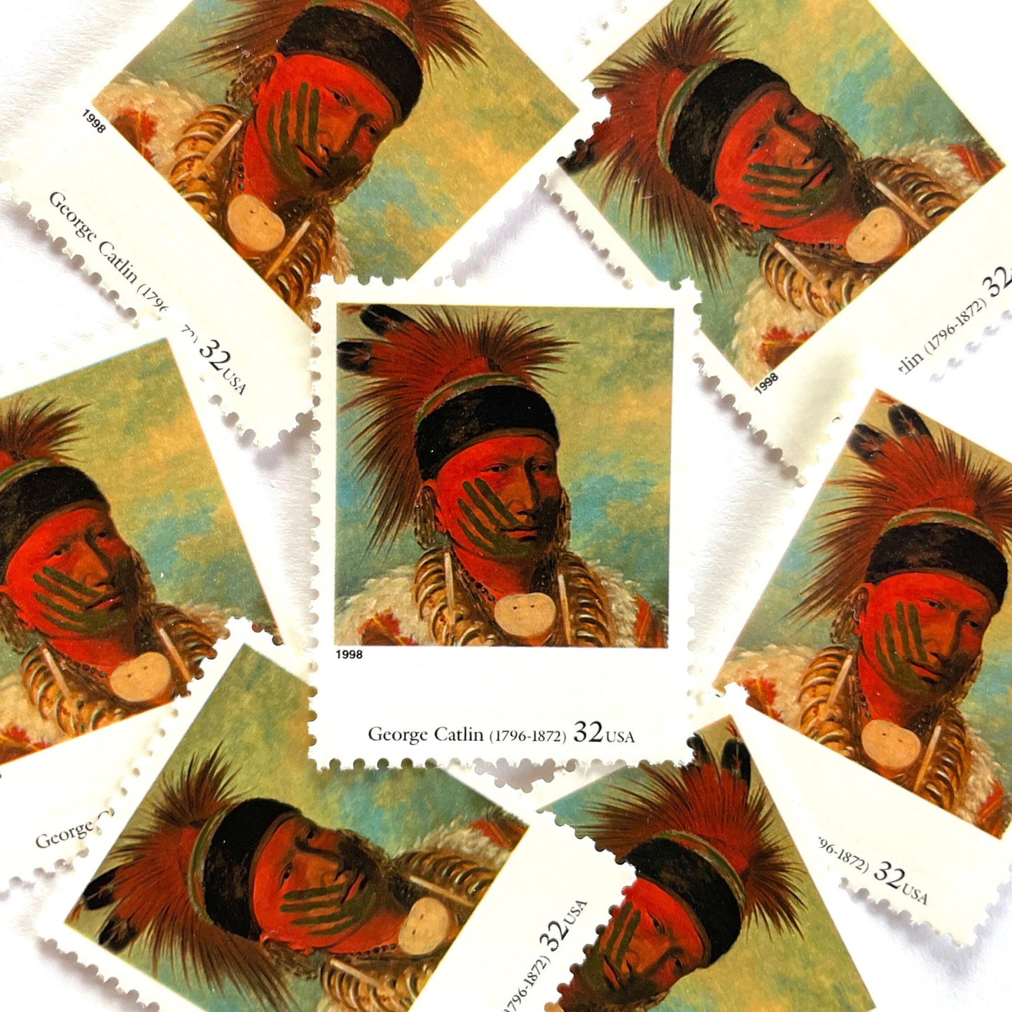 George Catlin’s “The White Cloud, Head Chief of the Iowas" Postage Stamp from the 1998 Four Centuries of American Art Series. This stamp depicts the iconic painting of Native American Indian Chief White Cloud in his ceremonial warpaint and feathers. An iconic western indigenous theme, this postage stamp depicts the pride and heritage of Native Americans. These are vintage unused USPS postage stamps with a face value of 32 cents each. Scott number 3236K.