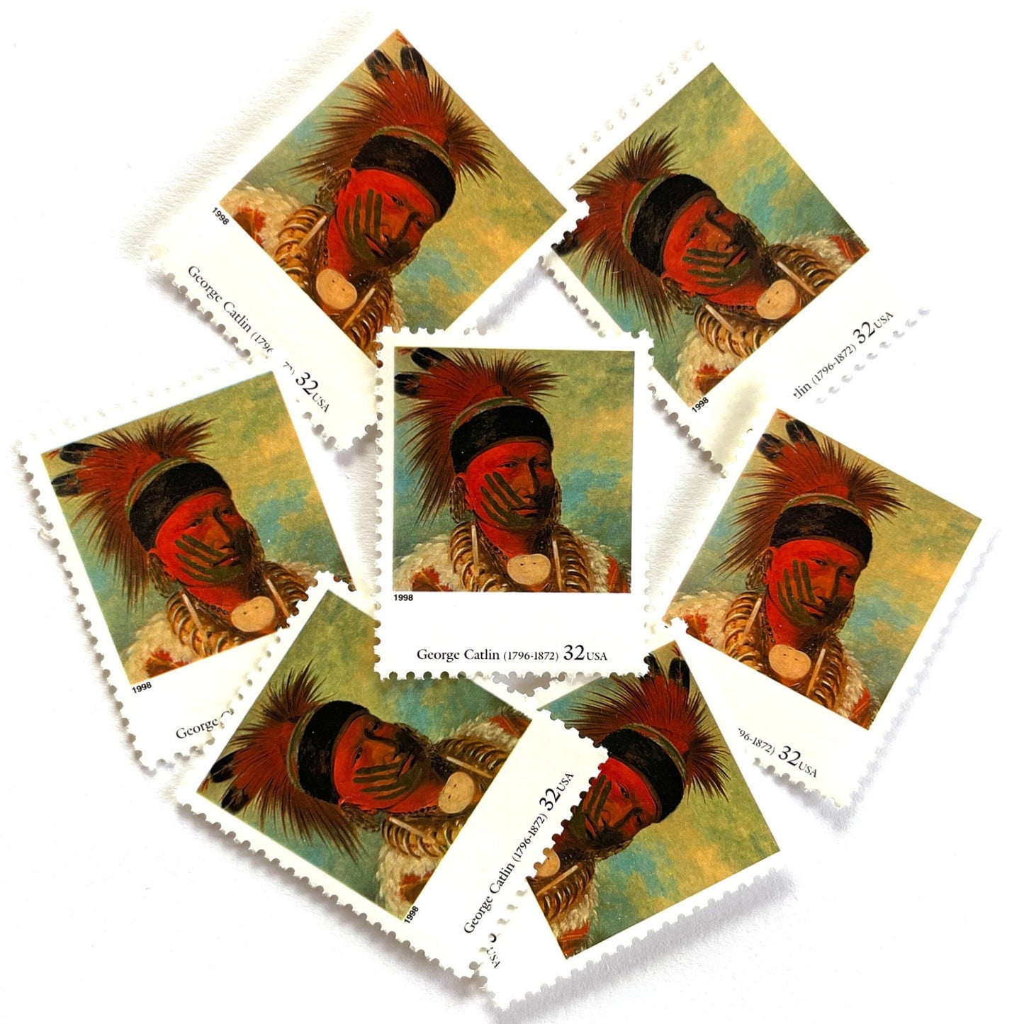 George Catlin’s “The White Cloud, Head Chief of the Iowas" Postage Stamp from the 1998 Four Centuries of American Art Series. This stamp depicts the iconic painting of Native American Indian Chief White Cloud in his ceremonial warpaint and feathers. An iconic western indigenous theme, this postage stamp depicts the pride and heritage of Native Americans. These are vintage unused USPS postage stamps with a face value of 32 cents each. Scott number 3236K.