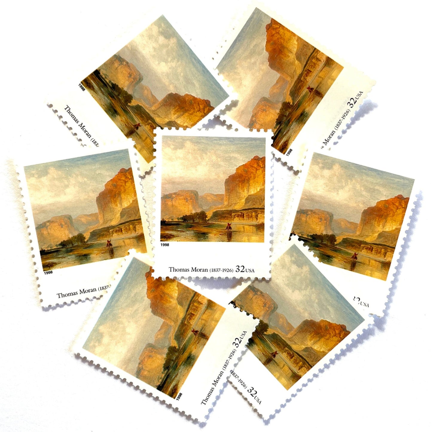 Thomas Moran’s “Cliffs of Green River" Postage Stamp from the 1998 Four Centuries of American Art Series. This stamp depicts a western landscape painting of the Green River at sunset or sunrise. An iconic nature theme, this predominately beige or neutral postage stamp depicts a lone horseback rider and is often used to mail wedding invitations. These are vintage unused USPS postage stamps with a face value of 32 cents each. Scott number 3236L.