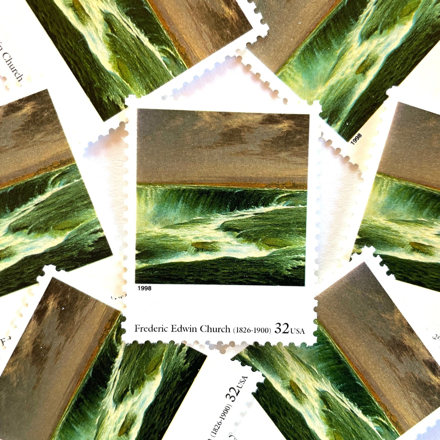 Frederic Edwin Church’s “Niagara” Postage Stamp from the 1998 Four Centuries of American Art Series. This stamp depicts the iconic landscape painting of Niagara Falls. An iconic nature theme, this stamp predominately green postage stamp depicts the waterfall that is shared by the United States and Canada and is a favorite honeymoon destination. These are vintage unused USPS postage stamps with a face value of 32 cents each. Scott number 3236N.