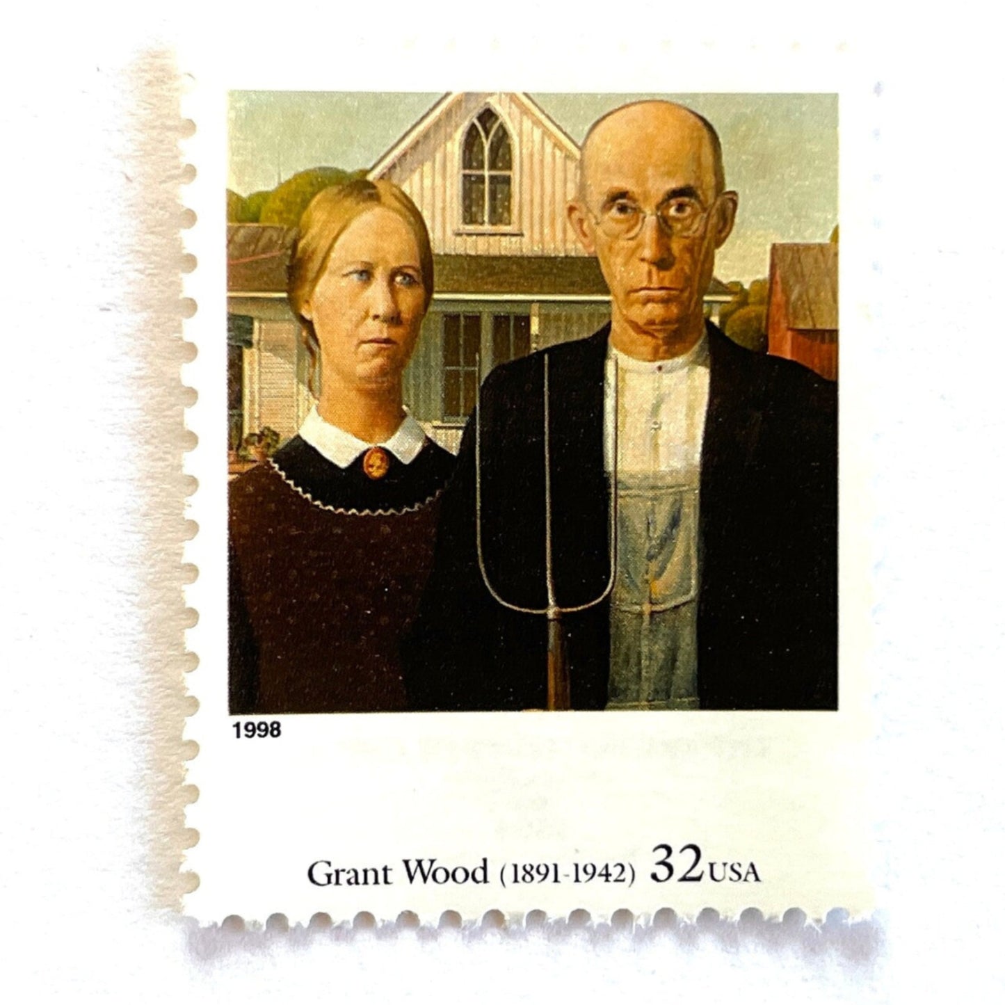 Grant Wood’s “American Gothic” Postage Stamp from the 1998 Four Centuries of American Art Series. This stamp depicts the iconic painting of man and woman, farmers or gardeners, standing in front of a farmhouse with a gothic style window. The man is holding a pitchfork. An iconic homesteading theme, this postage stamp depicts a couple and is often used for mailing wedding invitations and save the dates. These are vintage unused USPS postage stamps with a face value of 32 cents each. Scott number 3236Q.