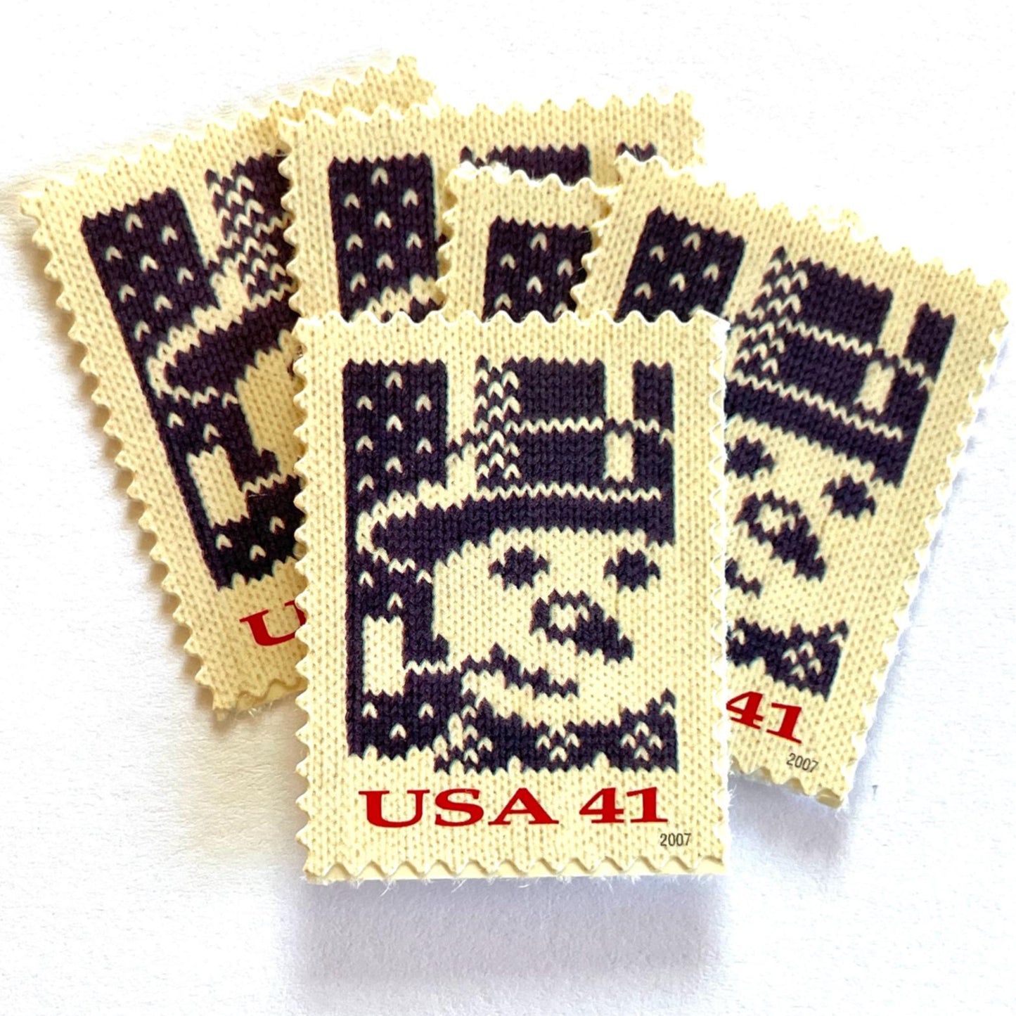 Image of 41-cent Contemporary Christmas Holiday Knits Snowman USPS postage stamp featuring a blue snowman on white background. Scott #4209. Themes: Christmas, Hanukkah, Holidays, Winter, Snow, Snowman, Frosty the Snowman, Blue Stamp.