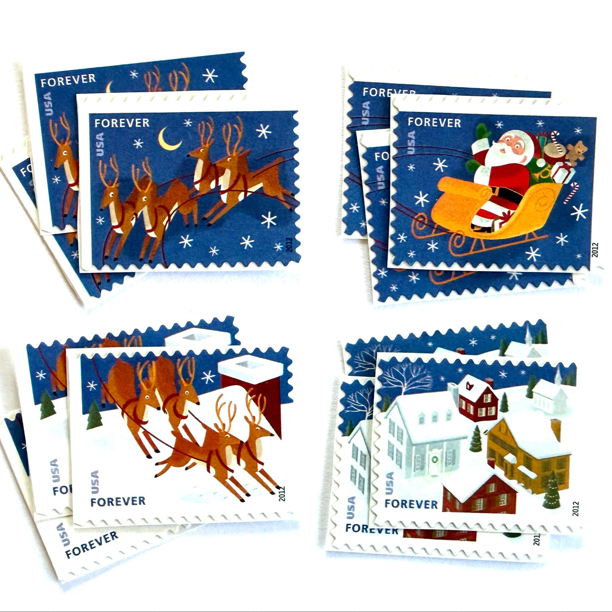 Santa and Sleigh four-stamp se-tenant postage sets from 2012 featuring Santa, flying reindeer, moonlit sky, and snow-covered rooftops on unused USPS Forever postage, Scott 4715a.