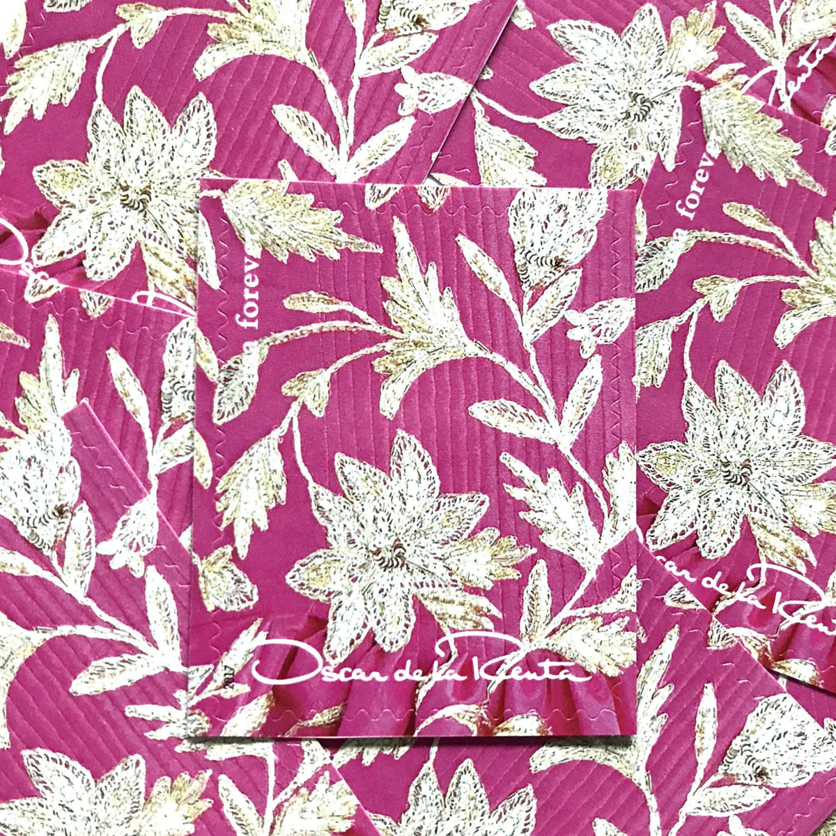 Oscar de la Renta Pink Floral Fabric postage stamps from 2017 featuring a pink, white and gray floral pattern on unused USPS Forever postage, Scott 5173j.