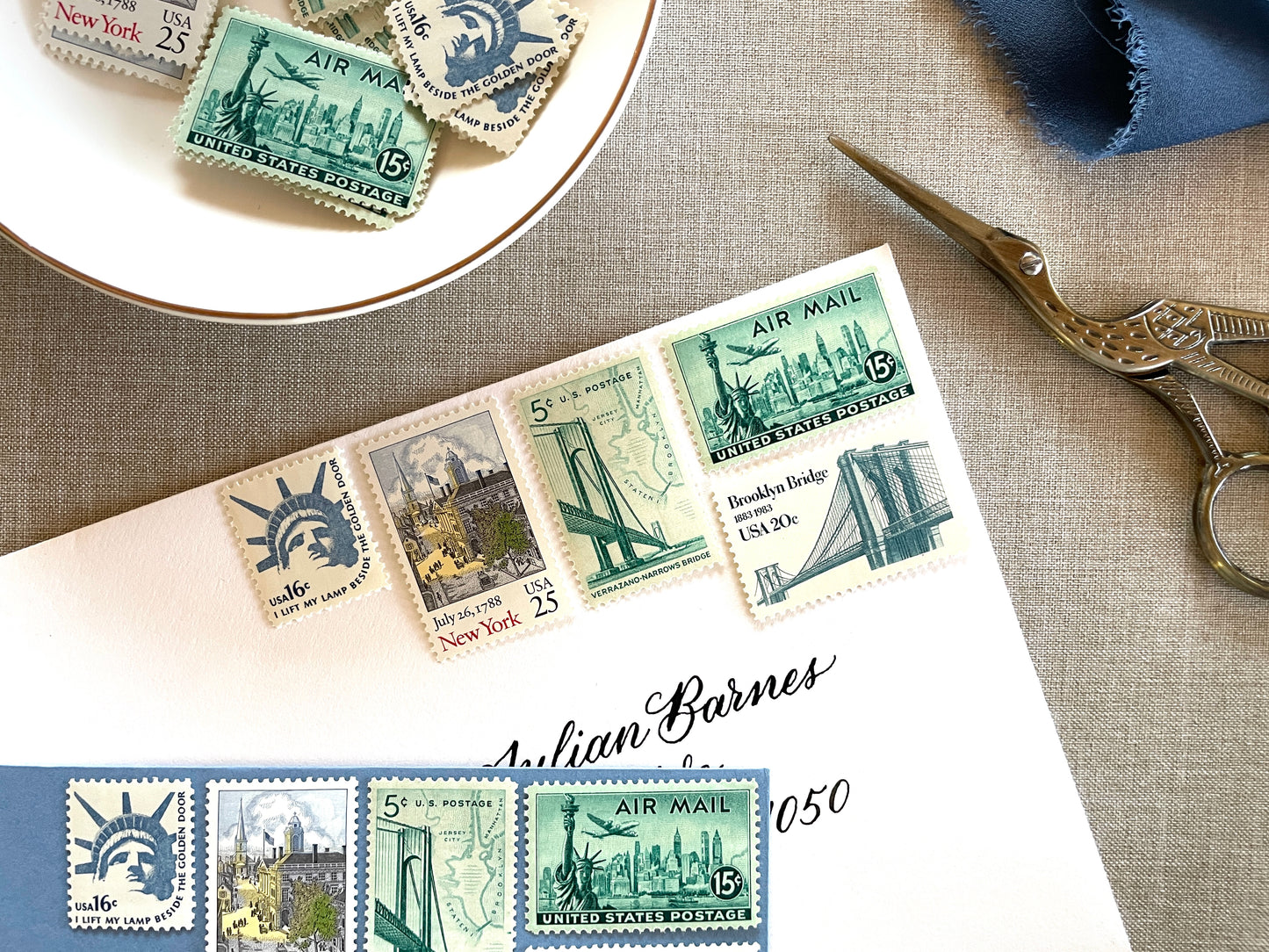 These unused vintage stamp sets are perfect for mailing New York or NYC-themed wedding invitations, save-the-dates, engagement announcements, bridal shower invites, thank you notes, or other special correspondence. Each curated set is comprised of five (5) unused stamps with a total USPS postage value of 81 cents — enough postage to mail a standard letter weighing up to 1 ounce. These unused U.S. stamps are perfectly valid for use as postage.
