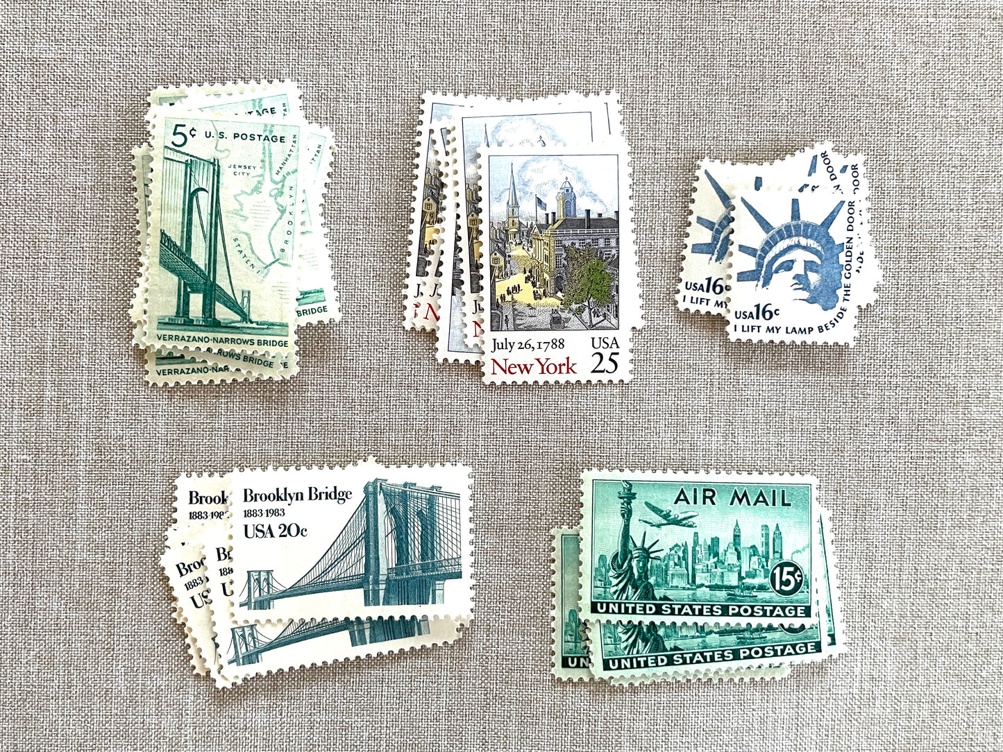 These unused vintage stamp sets are perfect for mailing New York or NYC-themed wedding invitations, save-the-dates, engagement announcements, bridal shower invites, thank you notes, or other special correspondence. Each curated set is comprised of five (5) unused stamps with a total USPS postage value of 81 cents — enough postage to mail a standard letter weighing up to 1 ounce. These unused U.S. stamps are perfectly valid for use as postage.