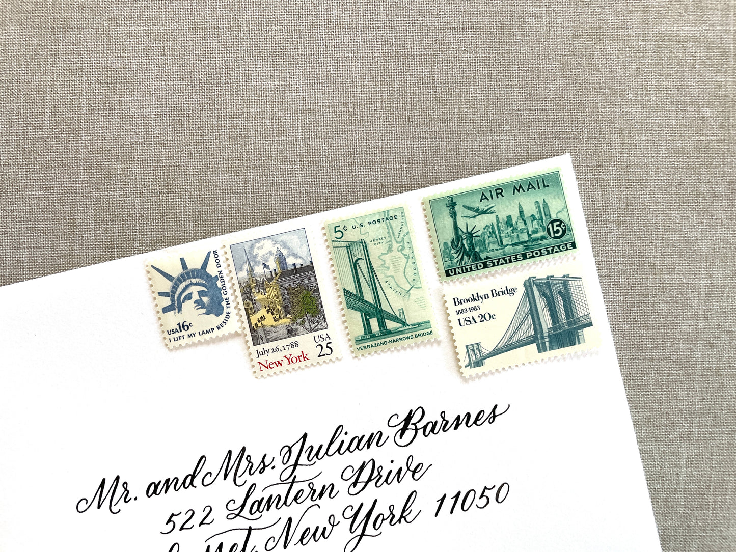 These unused vintage stamp sets are perfect for mailing New York or NYC-themed wedding invitations, save-the-dates, engagement announcements, bridal shower invites, thank you notes, or other special correspondence. Each curated set is comprised of five (5) unused stamps with a total USPS postage value of 81 cents — enough postage to mail a standard letter weighing up to 1 ounce. These unused U.S. stamps are perfectly valid for use as postage.