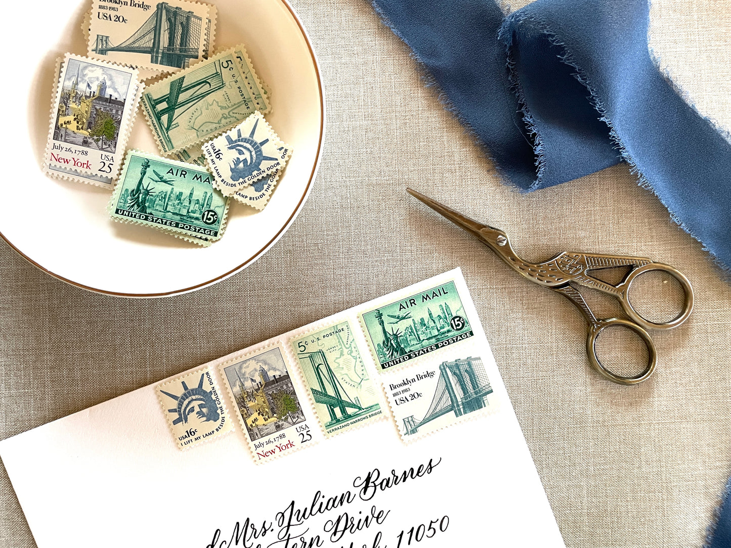 These unused vintage stamp sets are perfect for mailing New York or NYC-themed wedding invitations, save-the-dates, engagement announcements, bridal shower invites, thank you notes, or other special correspondence. Each curated set is comprised of five (5) unused stamps with a total USPS postage value of 81 cents — enough postage to mail a standard letter weighing up to 1 ounce. These unused U.S. stamps are perfectly valid for use as postage.