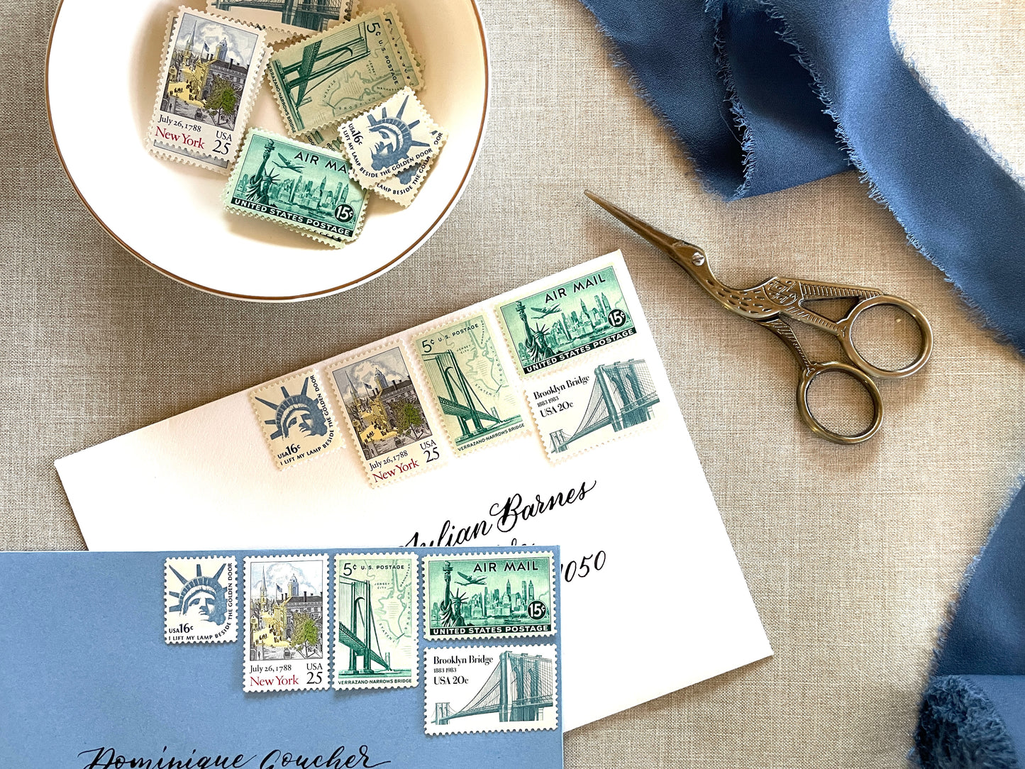 These unused vintage stamp sets are perfect for mailing New York or NYC-themed wedding invitations, save-the-dates, engagement announcements, bridal shower invites, thank you notes, or other special correspondence. Each curated set is comprised of five (5) unused stamps with a total USPS postage value of 81 cents — enough postage to mail a standard letter weighing up to 1 ounce. These unused U.S. stamps are perfectly valid for use as postage.