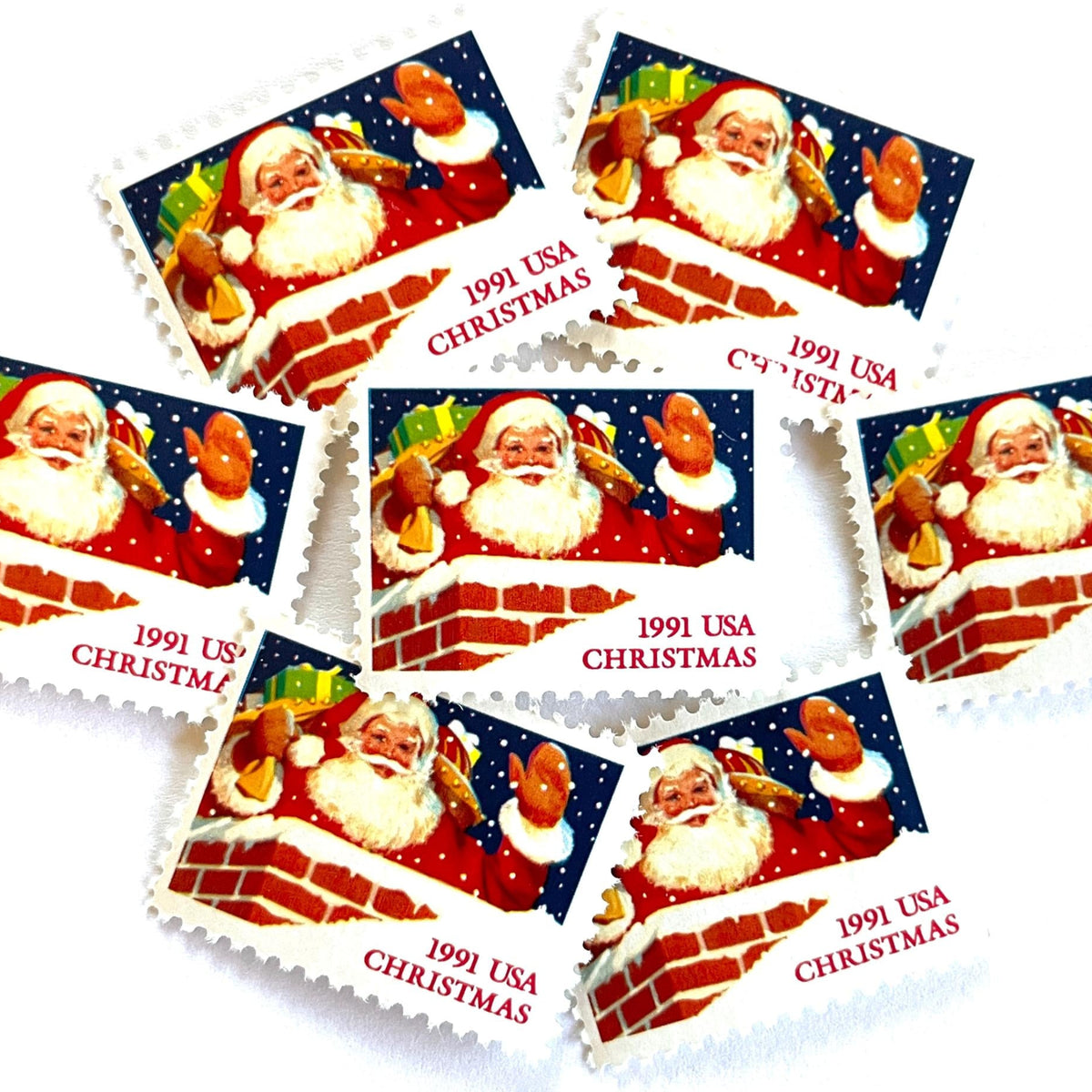 Image of 1991 Contemporary Christmas “Santa in Chimney” 29-cent stamps. Scott #2579. Stamp Themes: Santa Claus, Christmas, Holidays, Rooftop, Snowing, Presents. Red postage stamp.