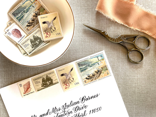 These unused vintage stamp sets are perfect for mailing beach, nautical, coastal, and marine-themed save-the-dates, wedding invitations, bridal shower invitations, and other special correspondence. Each curated set is comprised of four (4) unused stamps with a total USPS postage value of 79 cents — enough postage to mail a standard rectangular envelope that weighs up to one (1) ounce. These unused U.S. stamps are perfectly valid for use as current postage for mailing with USPS.