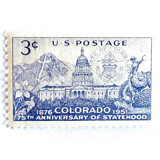 Image of Colorado Statehood postage stamps from 1951, featuring the Colorado State Capitol, Mount of the Holy Cross, state seal, columbine flower, and cowboy on horseback on vintage unused 3-cent USPS postage, Scott 1001.