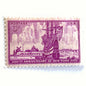 Image of 1953 “New York City” 300th Anniversary 3-cent mail stamps. Scott #1027. Stamp Themes: New York City, NYC, Big Apple, New Amsterdam, Dutch Settlement, New York Skyline, Sailing. Red/violet postage stamp.