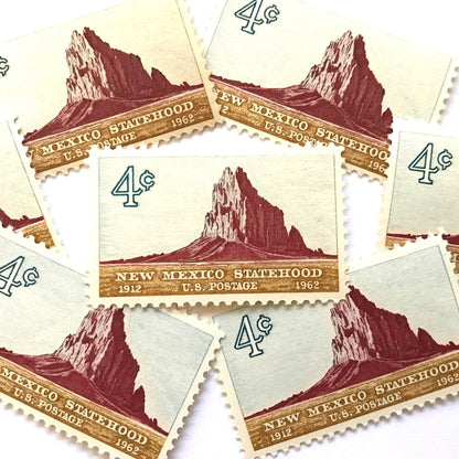 Image of New Mexico Statehood postage stamps from 1962, featuring a Southwestern desert landscape associated with Shiprock on vintage unused 4-cent USPS postage, Scott 1191.