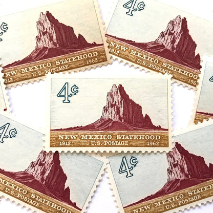 Image of New Mexico Statehood postage stamps from 1962, featuring a Southwestern desert landscape associated with Shiprock on vintage unused 4-cent USPS postage, Scott 1191.