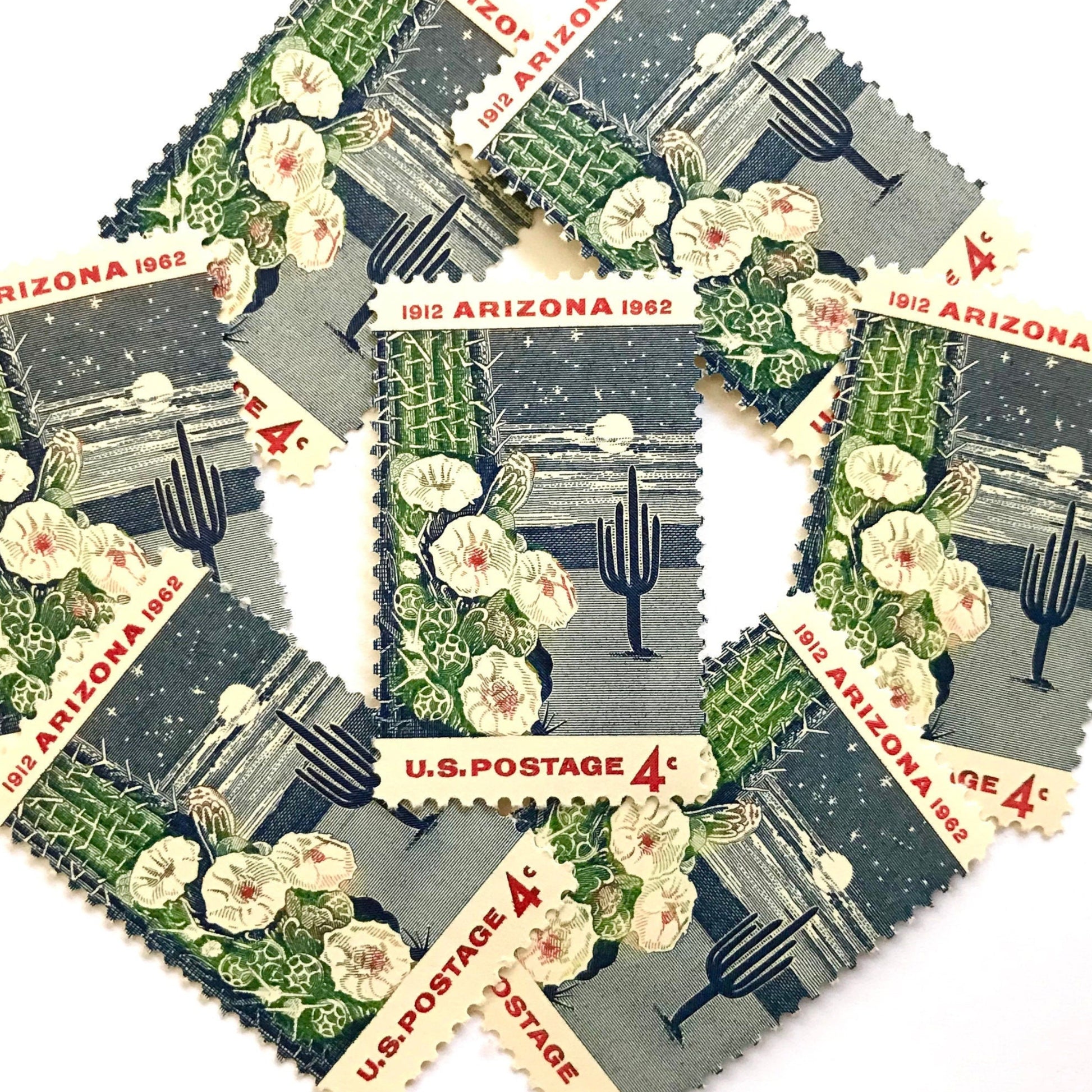 Image of Arizona Statehood postage stamps from 1962, featuring a moonlit desert scene with a saguaro cactus and cactus flower on vintage unused 4-cent USPS postage, Scott 1192.