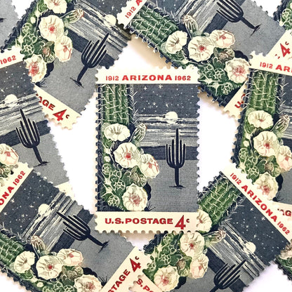 Image of Arizona Statehood postage stamps from 1962, featuring a moonlit desert scene with a saguaro cactus and cactus flower on vintage unused 4-cent USPS postage, Scott 1192.
