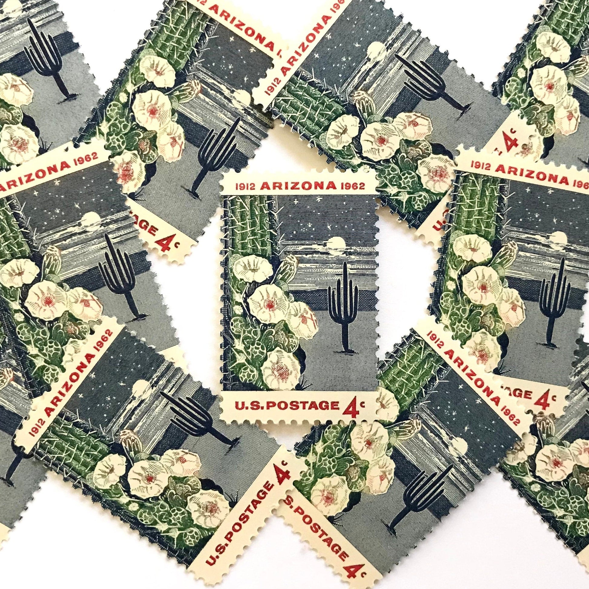 Image of Arizona Statehood postage stamps from 1962, featuring a moonlit desert scene with a saguaro cactus and cactus flower on vintage unused 4-cent USPS postage, Scott 1192.