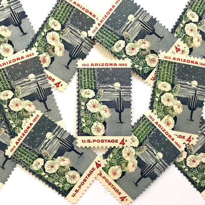 Image of Arizona Statehood postage stamps from 1962, featuring a moonlit desert scene with a saguaro cactus and cactus flower on vintage unused 4-cent USPS postage, Scott 1192.