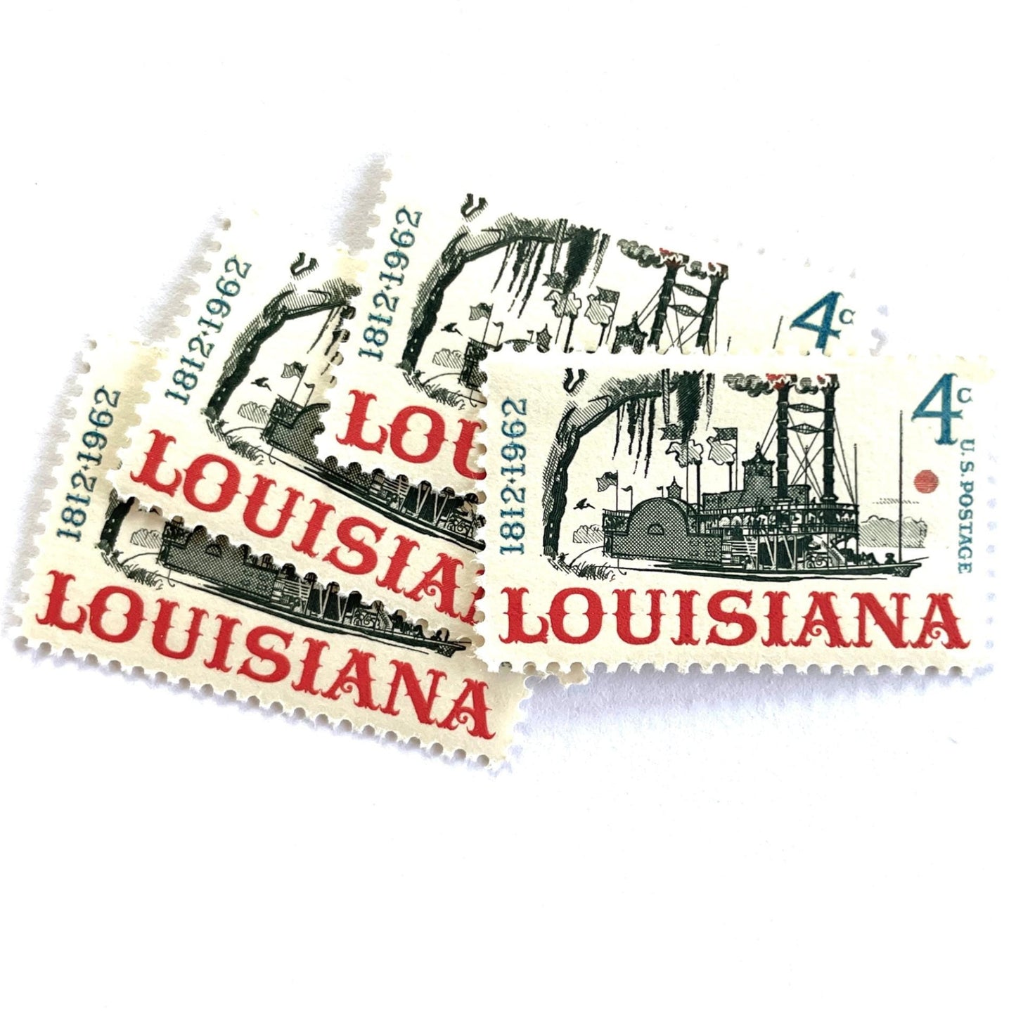 Image of Louisiana Statehood postage stamps from 1962, featuring a Mississippi River steamboat on vintage unused 4-cent USPS postage, Scott 1197.