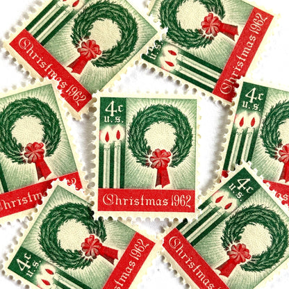 Image of 1962 Contemporary Christmas “Christmas Wreath and Candles” 4-cent stamps. Scott #1205. Stamp Themes: Wreath, Candles, Red Bow, Holidays, First U.S. Christmas Stamp. Green and red postage stamp.