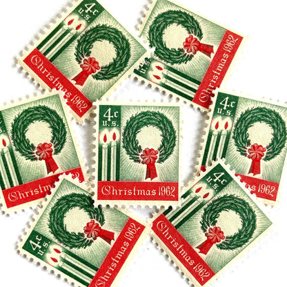 Image of 1962 Contemporary Christmas “Christmas Wreath and Candles” 4-cent stamps. Scott #1205. Stamp Themes: Wreath, Candles, Red Bow, Holidays, First U.S. Christmas Stamp. Green and red postage stamp.