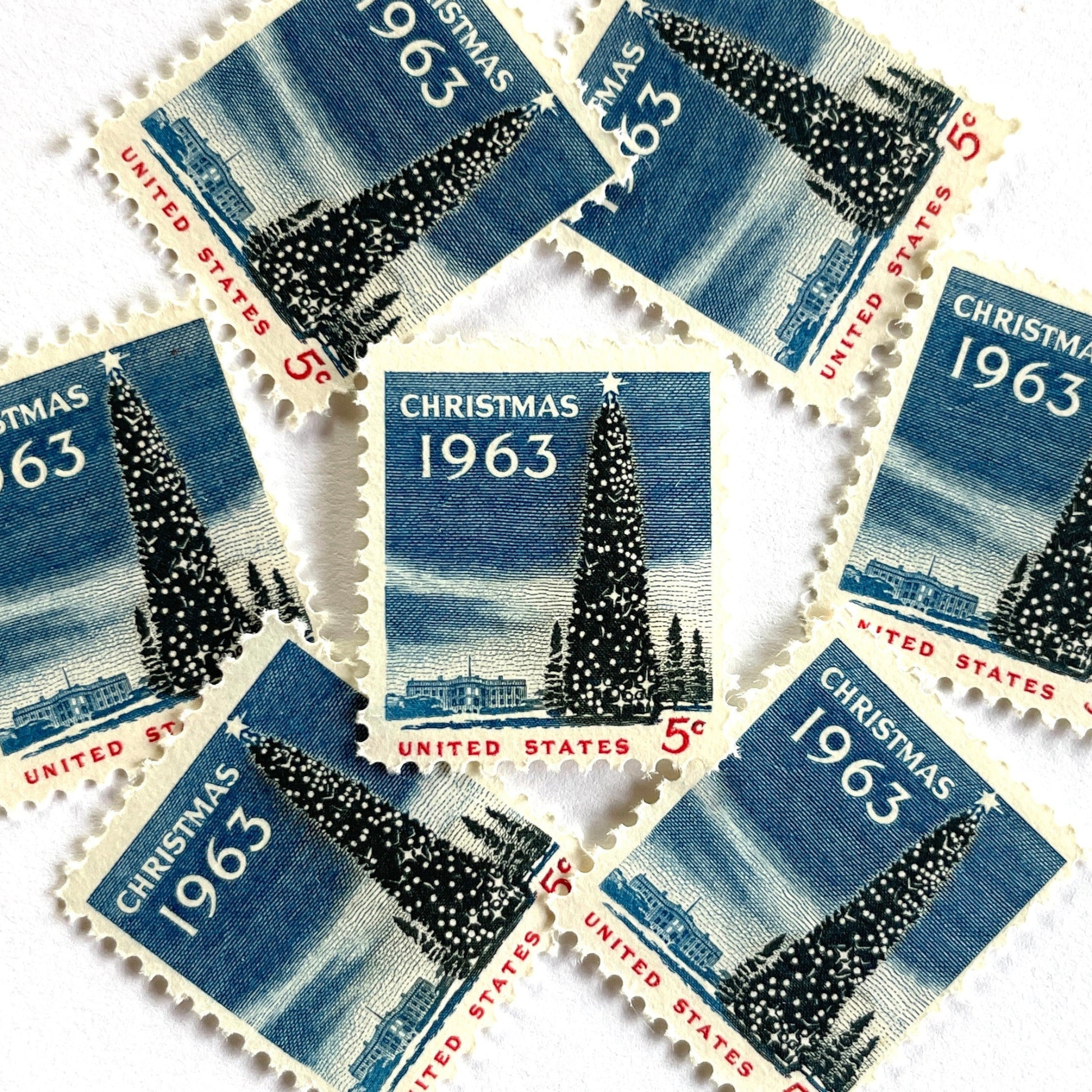 Image of 1963 “Christmas Tree and White House” 5-cent stamps. Scott #1240. Stamp Themes: National Christmas Tree, The White House, Capitol, Washington DC, Winter Christmas Scene, Holidays. Blue, white, red postage stamp.
