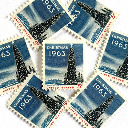 Image of 1963 “Christmas Tree and White House” 5-cent stamps. Scott #1240. Stamp Themes: National Christmas Tree, The White House, Capitol, Washington DC, Winter Christmas Scene, Holidays. Blue, white, red postage stamp.