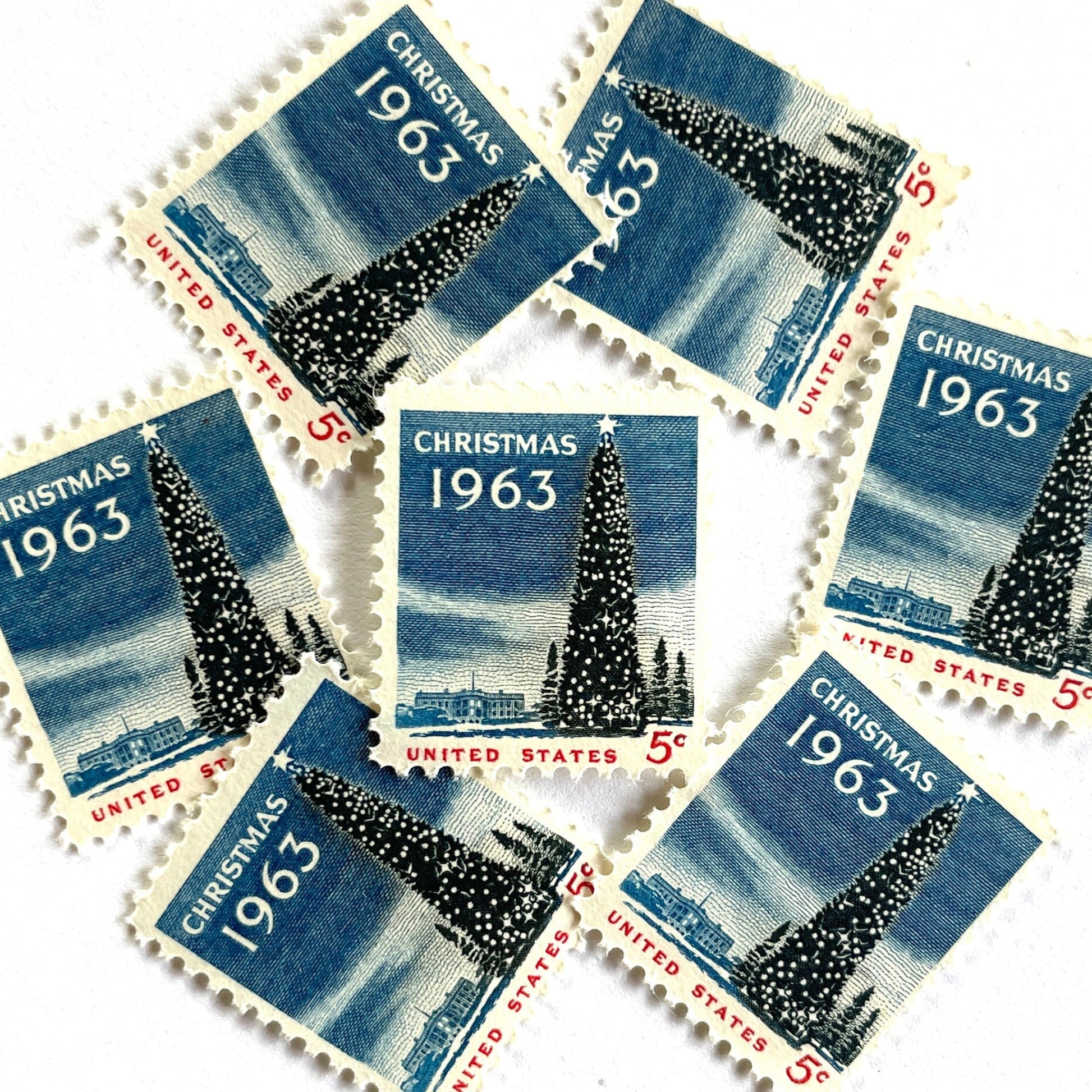 Image of 1963 “Christmas Tree and White House” 5-cent stamps. Scott #1240. Stamp Themes: National Christmas Tree, The White House, Capitol, Washington DC, Winter Christmas Scene, Holidays. Blue, white, red postage stamp.
