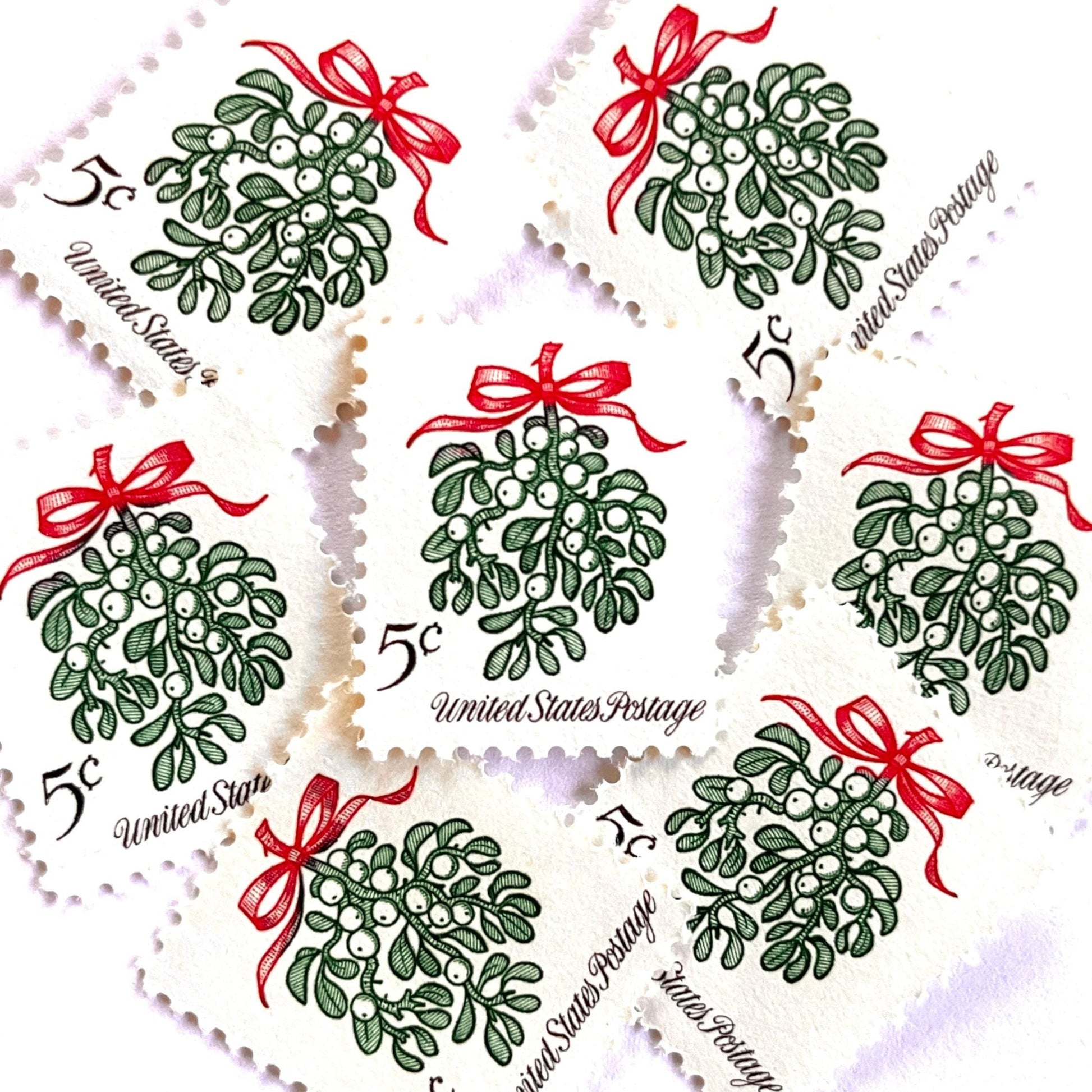 Image of 1964 Third Christmas Issue “Mistletoe” 5-cent mail stamps. Scott #1255. Stamp Themes: Christmas, Holidays, Winter Flora, Kissing, Holiday Plant, Holiday Décor. Green and red postage stamp.