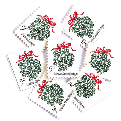 Image of 1964 Third Christmas Issue “Mistletoe” 5-cent mail stamps. Scott #1255. Stamp Themes: Christmas, Holidays, Winter Flora, Kissing, Holiday Plant, Holiday Décor. Green and red postage stamp.
