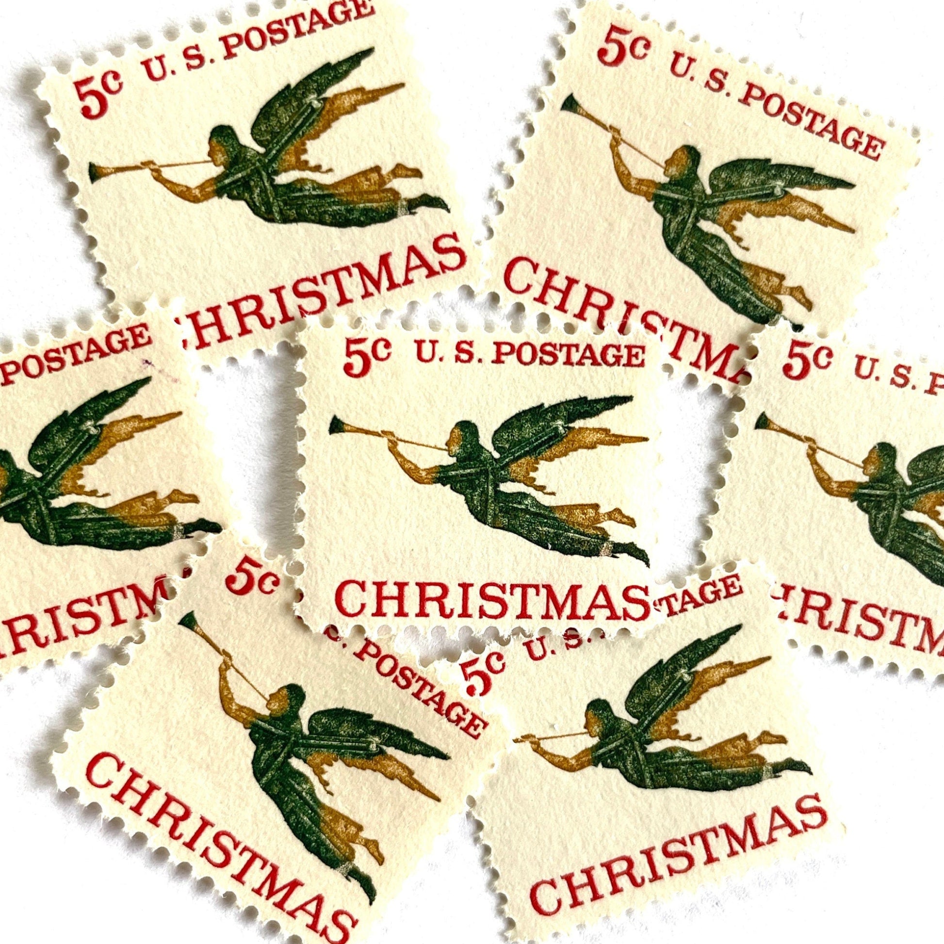 Image of 1965 “Christmas Angel” 5-cent stamps. Scott #1276. Stamp Themes: Christmas, Holidays, Angel, Weathervane, Horn, Trumpet. Green, red, white postage stamp.