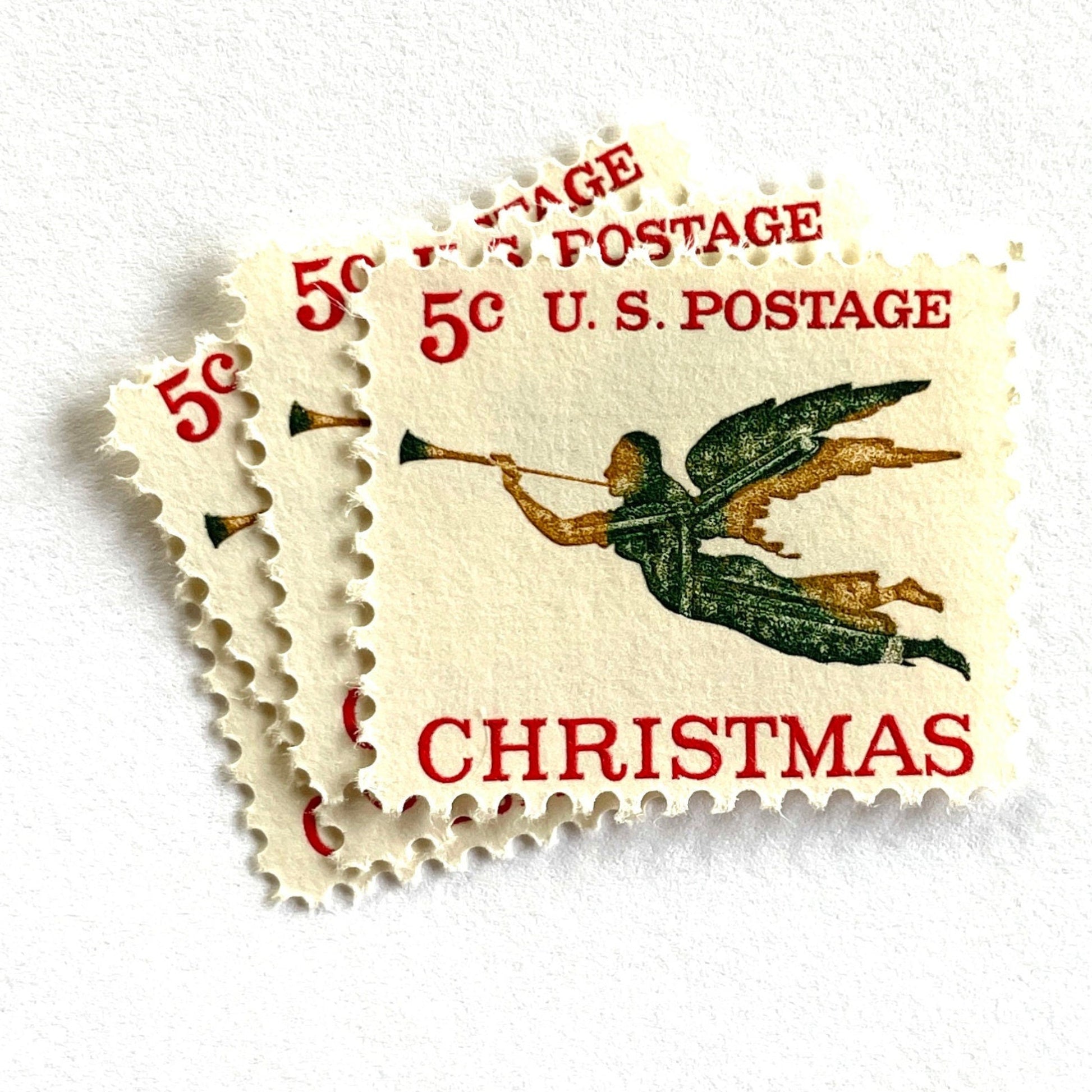 Image of 1965 “Christmas Angel” 5-cent stamps. Scott #1276. Stamp Themes: Christmas, Holidays, Angel, Weathervane, Horn, Trumpet. Green, red, white postage stamp.