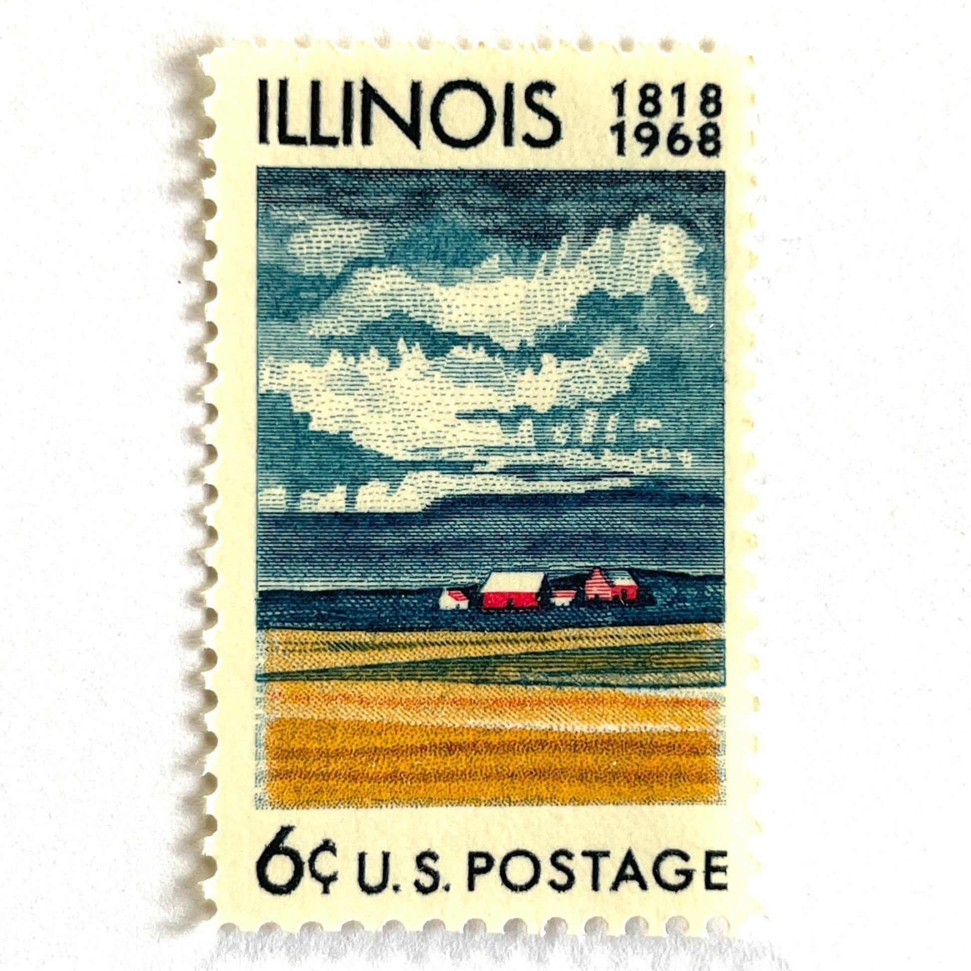 Image of Illinois Statehood postage stamps from 1968, issued for the 150th anniversary of Illinois statehood, featuring a farm on the Prairie with dramatic clouds overhead artwork on vintage unused 6-cent USPS postage, Scott 1339.