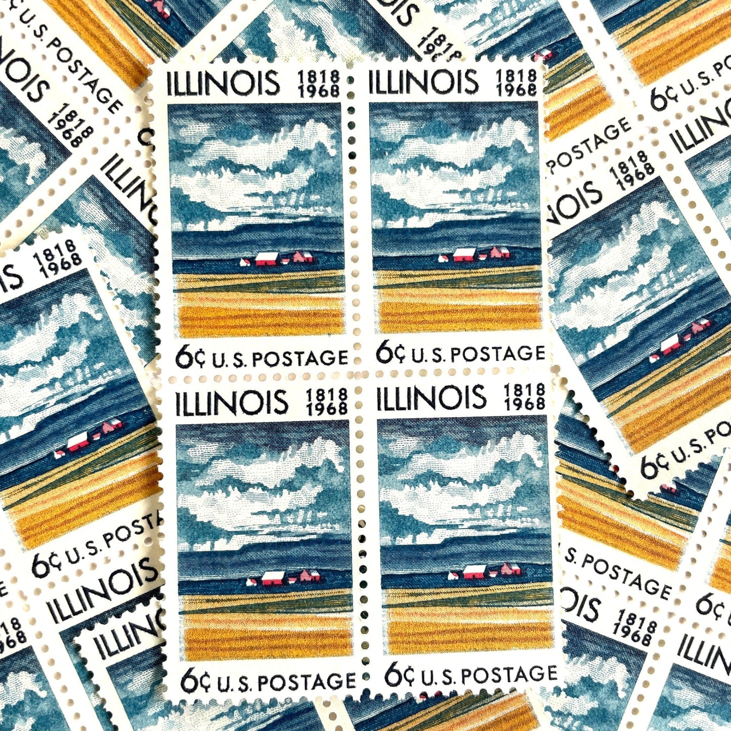 Image of Illinois Statehood postage stamps from 1968, issued for the 150th anniversary of Illinois statehood, featuring a farm on the Prairie with dramatic clouds overhead artwork on vintage unused 6-cent USPS postage, Scott 1339.