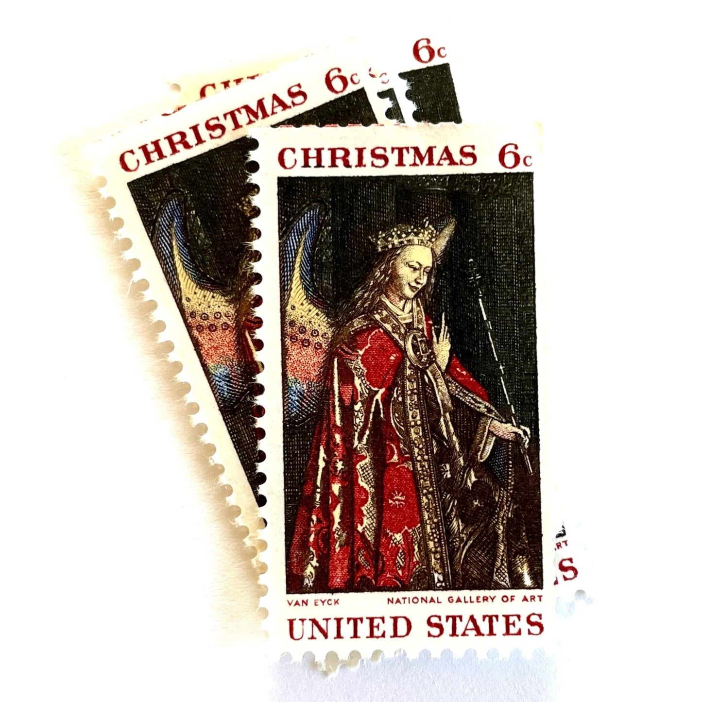 Image of 1968 Christmas Issue “Angel Gabriel” 6-cent stamps. Scott #1363. Stamp Themes: Christmas, Angel, Painting, The Annunciation, Christian Art, Renaissance Painting. Red postage stamp.