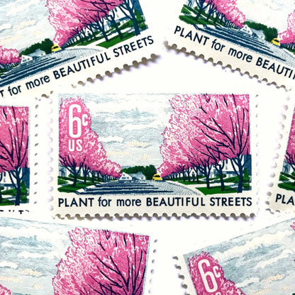 Image of 1966 Beautification of America Plant for More Beautiful Streets 6 cent stamps. Scott #1368. Stamp themes: Trees, Cherry Blossoms, Planting, Arbor Day, Streets, Neighborhood, Suburbs. Pink postage stamp.
